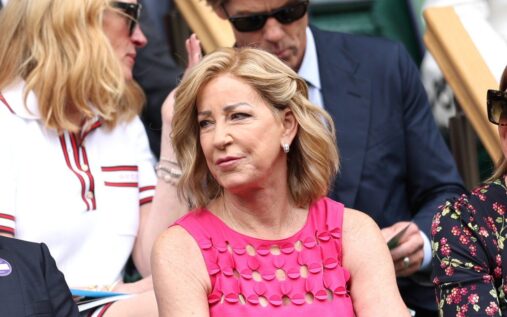 Chris Evert looking on from the commentary box at a major tennis tournament