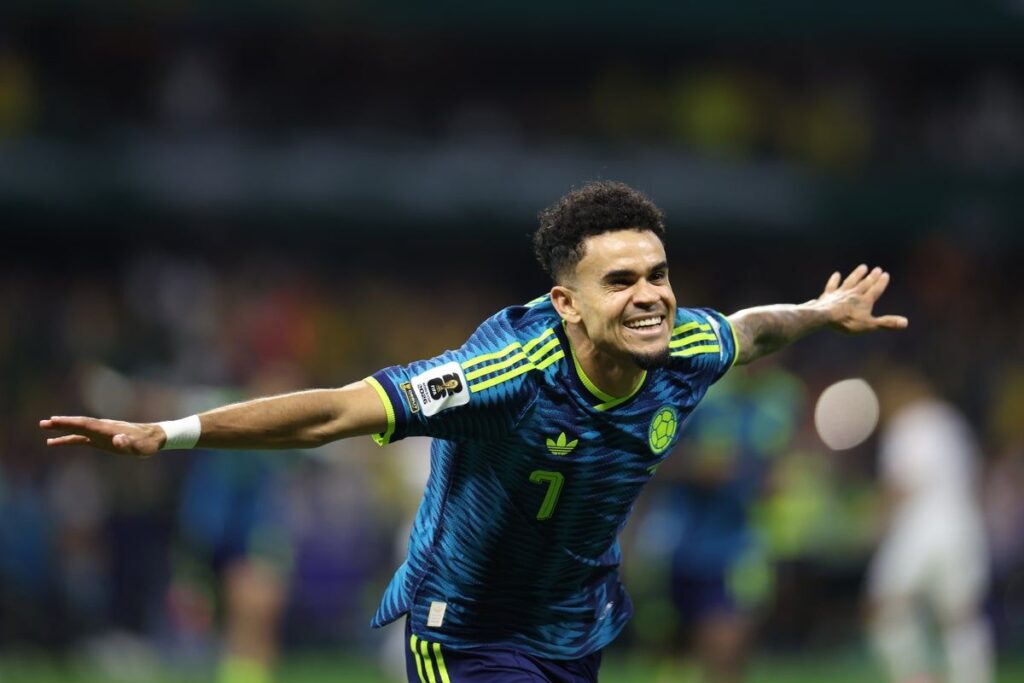 Colombia football players celebrating a goal during their 3-1 World Cup victory over Uzbekistan at the Azteca Stadium
