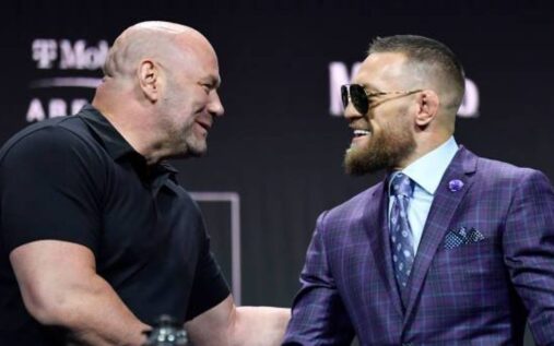 Conor McGregor standing inside the UFC octagon looking intently ahead
