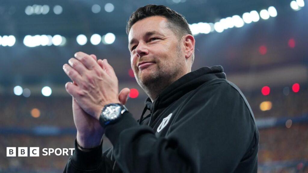 Lens manager Pierre Sage directing his team from the touchline during a football match