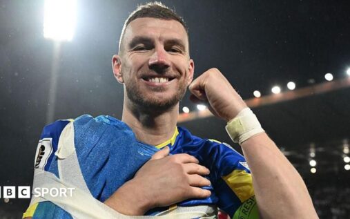 Edin Dzeko playing for Bosnia-Herzegovina in his national team football kit.