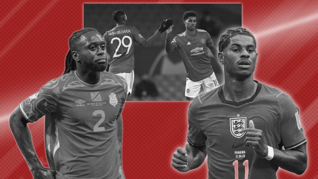 Marcus Rashford and Aaron Wan-Bissaka competing for the ball during a football match