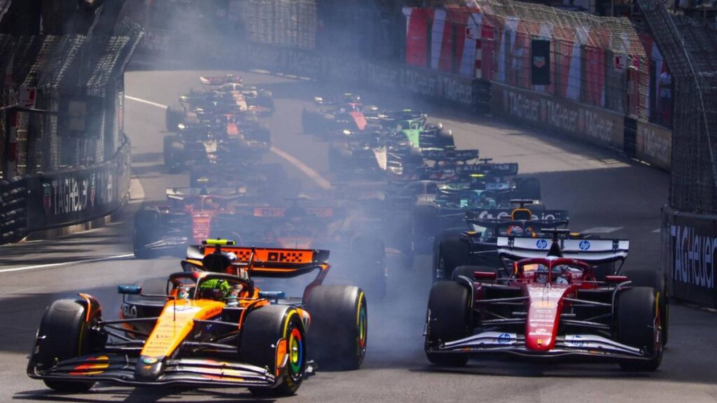 Esteban Ocon and Oliver Bearman driving Haas Formula 1 cars on the Monaco Grand Prix street circuit.