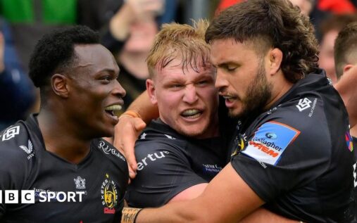 Exeter Chiefs players celebrating a try against Saracens during their crucial Premiership Rugby clash