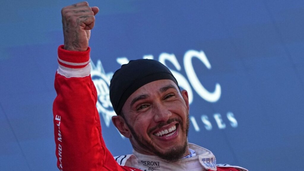 Lewis Hamilton driving his red Ferrari Formula 1 car on track