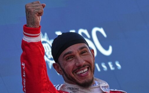 Lewis Hamilton driving his red Ferrari Formula 1 car on track