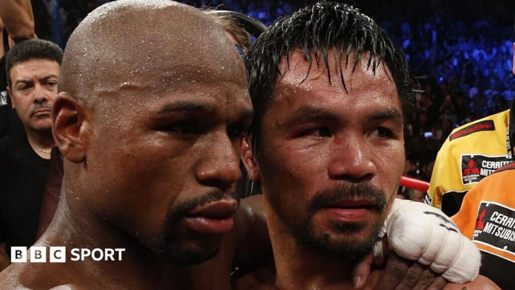 Manny Pacquiao and Floyd Mayweather standing face-to-face inside a boxing ring