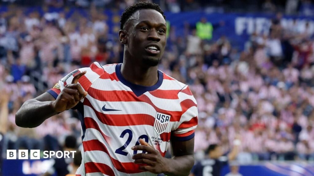 United States striker Folarin Balogun celebrating a goal at the World Cup