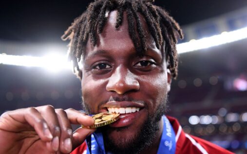 Divock Origi celebrating a goal in a Liverpool shirt