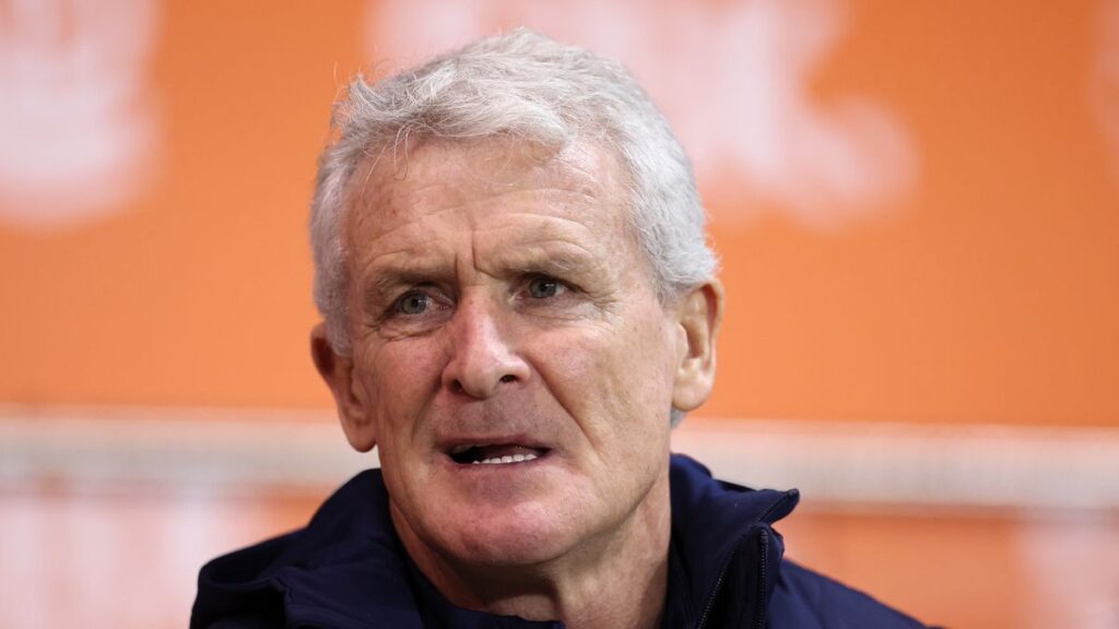 Mark Hughes looking thoughtful on the touchline during a professional football match