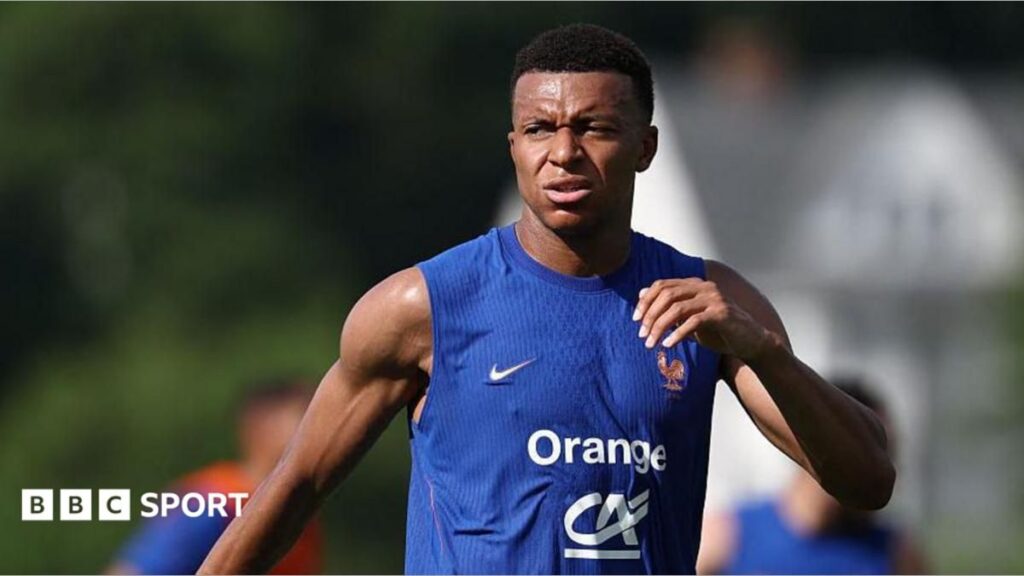 Kylian Mbappe pointing and issuing instructions while playing for the France national team