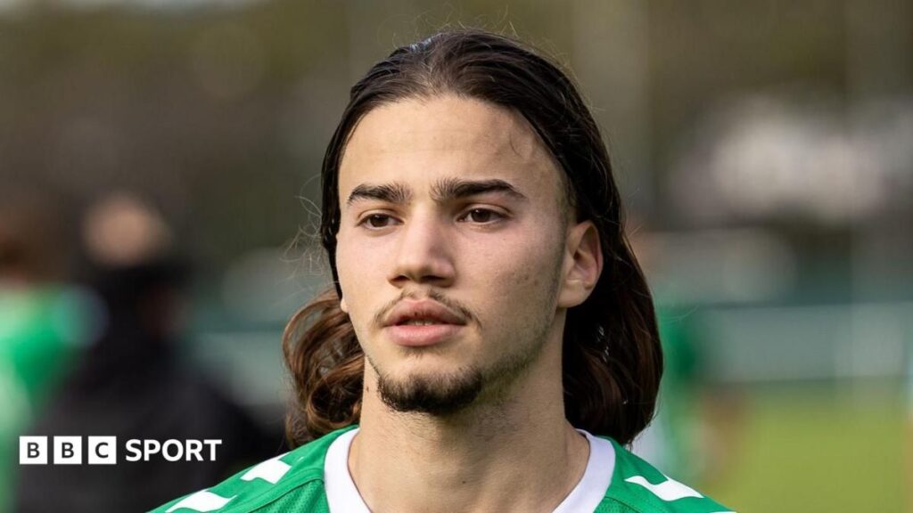 Portrait of French footballer Kenzo Kies wearing a Guingamp kit
