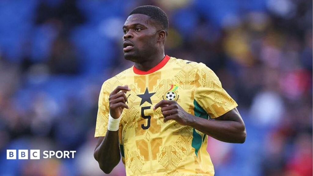Thomas Partey playing in a Ghana national team football kit