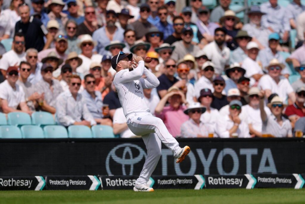 Glenn Phillips raising his bat to celebrate a maiden Test century for New Zealand against England