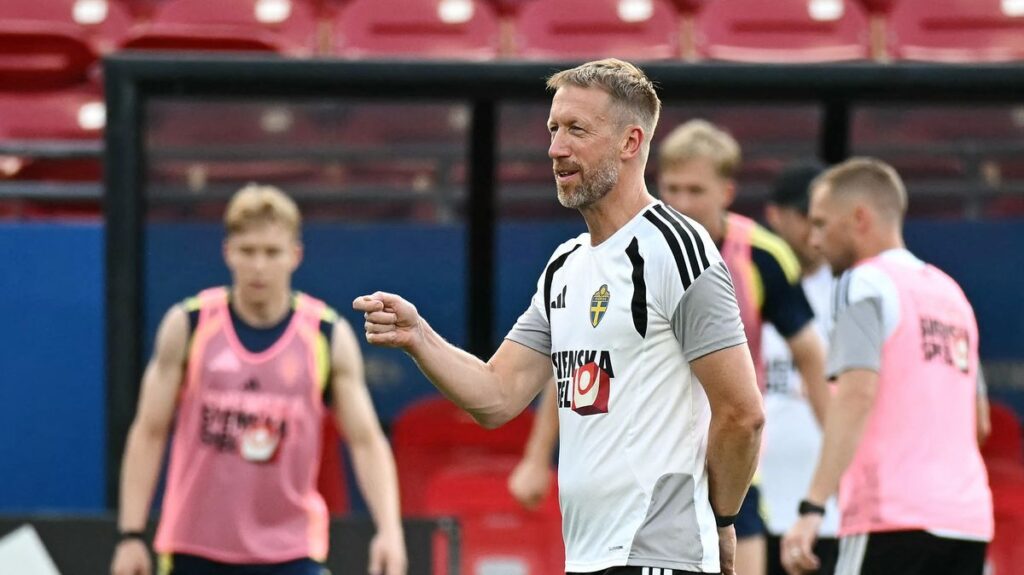 Graham Potter standing on the touchline managing the Sweden national team