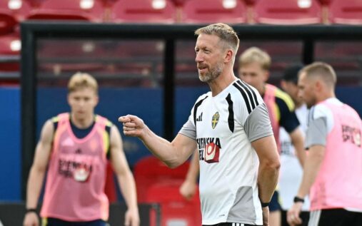 Graham Potter standing on the touchline managing the Sweden national team