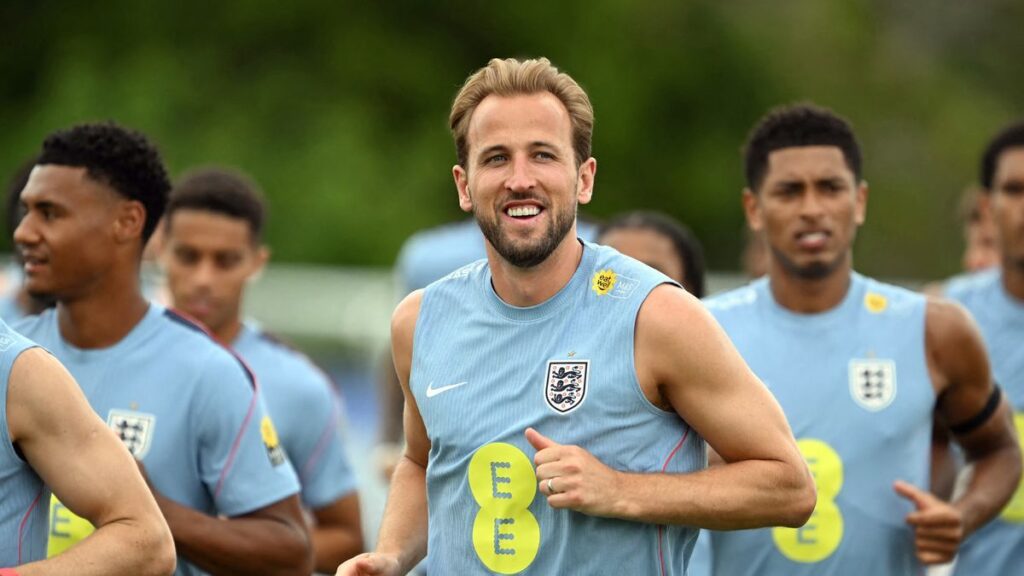 Harry Kane wearing the England captain's armband looking determined on the pitch