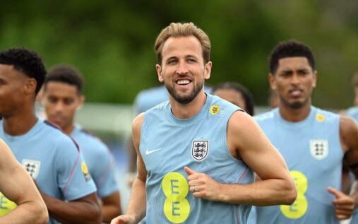 Harry Kane wearing the England captain's armband looking determined on the pitch