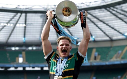 Henry Pollock celebrating with the Premiership trophy after Northampton Saints' final victory