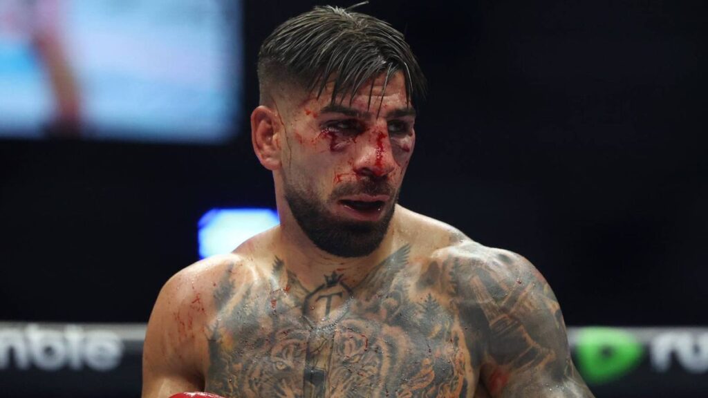 Ilia Topuria looking dejected in the Octagon following his lightweight championship defeat at UFC Freedom 250