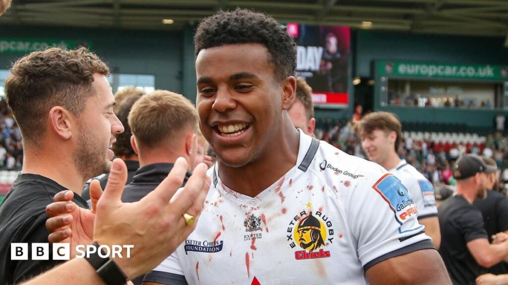 England winger Immanuel Feyi-Waboso running with the ball during a rugby match for Exeter Chiefs