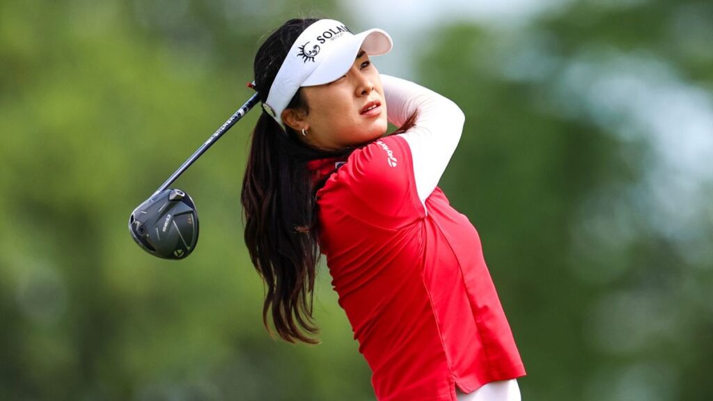 Ina Yoon celebrating a successful putt on the green at the Women's PGA Championship
