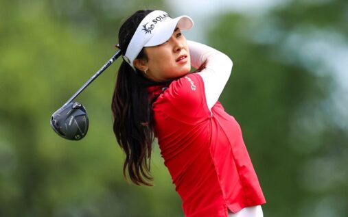 Ina Yoon celebrating a successful putt on the green at the Women's PGA Championship