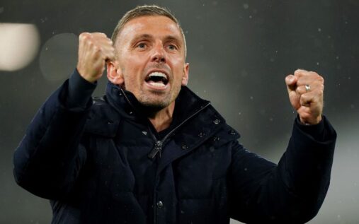 Gary O'Neil holding an Ipswich Town scarf at Portman Road after being announced as the club's new manager