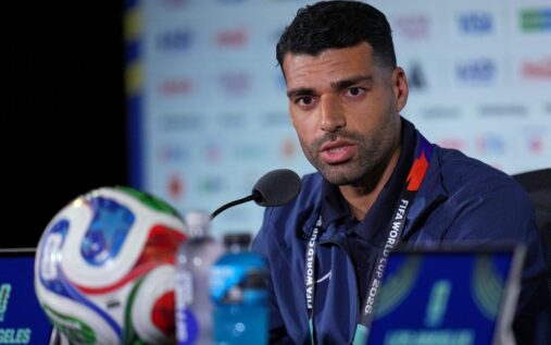 Iran captain Mehdi Taremi speaking seriously during a World Cup press conference