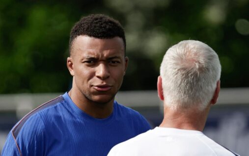 Kylian Mbappe speaking to the media in a Real Madrid kit