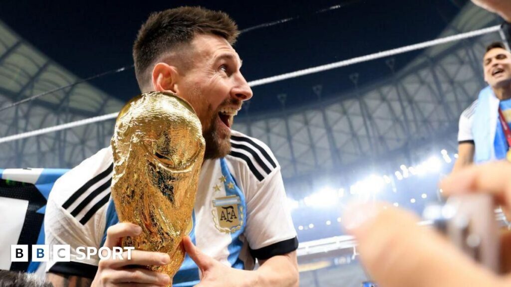 Lionel Messi in action for Argentina pointing to the sky