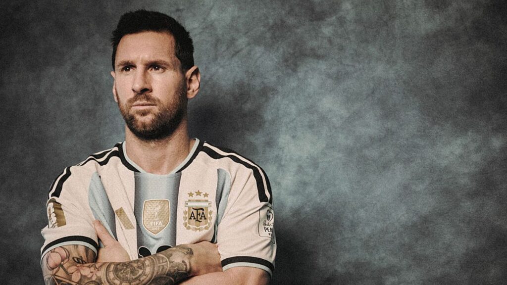 Lionel Messi wearing the Argentina national team kit looking focused on the pitch