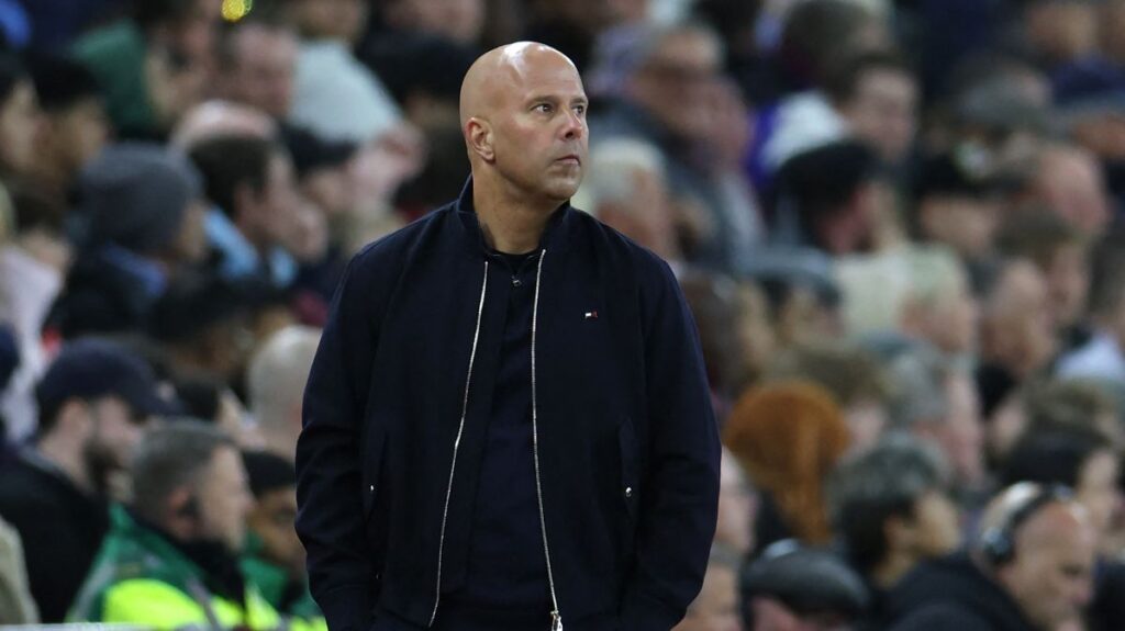 Liverpool manager Andoni Iraola looking thoughtful on the touchline during a Premier League match