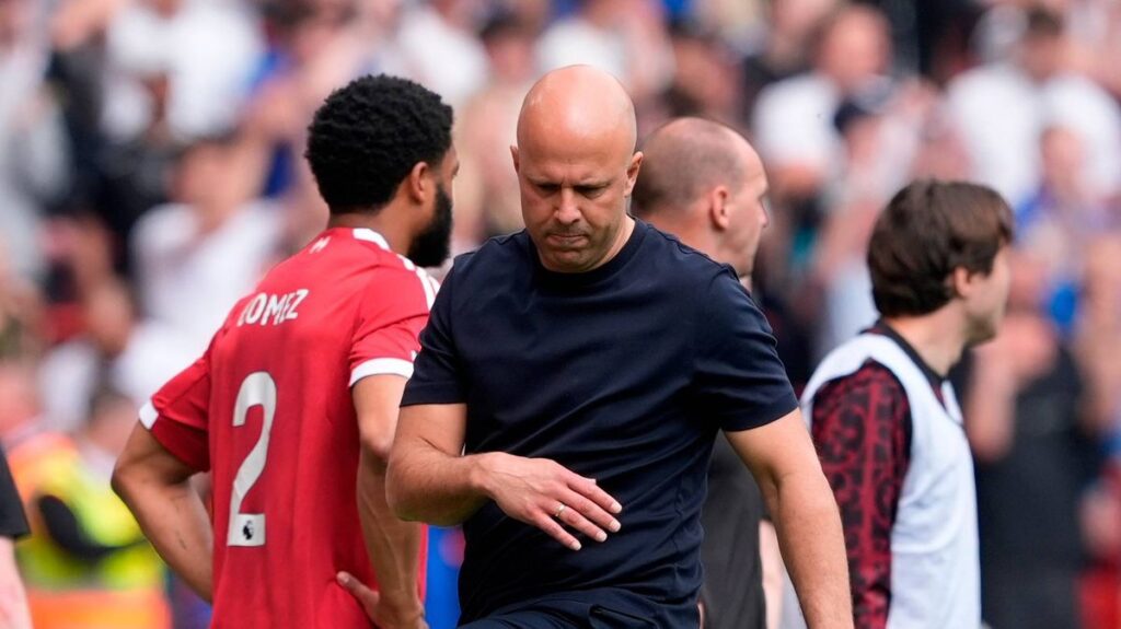 Arne Slot looking thoughtful on the touchline during a Liverpool Premier League match
