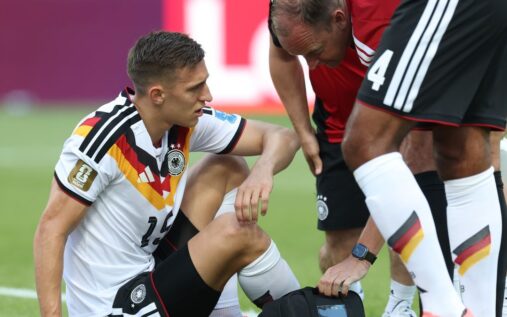 Nico Schlotterbeck receiving medical treatment on the pitch during Germany's World Cup match against Ivory Coast