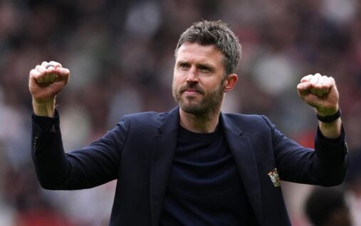 Michael Carrick standing on the touchline managing Manchester United during a match