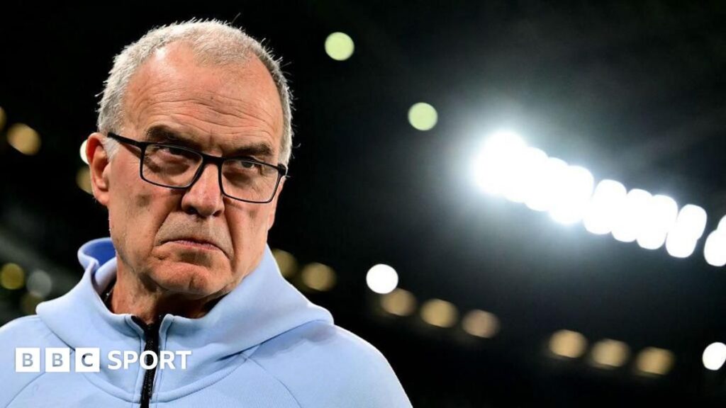 Marcelo Bielsa looking thoughtful on the touchline while managing Uruguay
