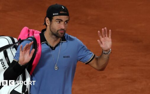 Matteo Berrettini sits disconsolate in his chair after retiring from his French Open quarter-final
