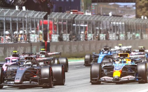 Max Verstappen and Oscar Piastri walking through the Formula 1 paddock