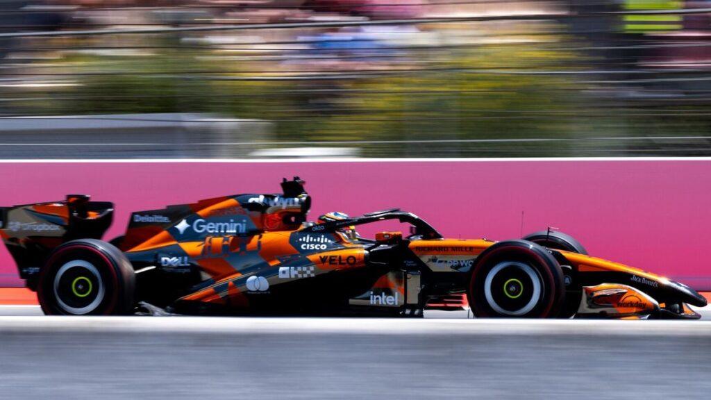 A McLaren Formula 1 car navigating the tight corners of the Monaco Grand Prix street circuit
