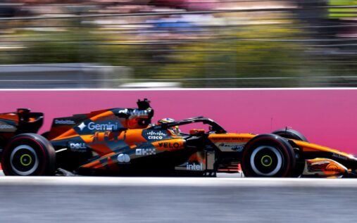 A McLaren Formula 1 car navigating the tight corners of the Monaco Grand Prix street circuit