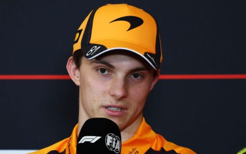 Oscar Piastri speaking to the media wearing McLaren team apparel