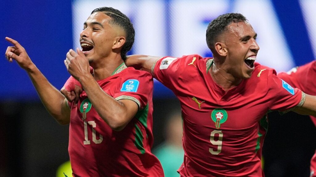 Morocco football players celebrating a goal against Haiti at the Mercedes-Benz Stadium
