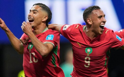 Morocco football players celebrating a goal against Haiti at the Mercedes-Benz Stadium
