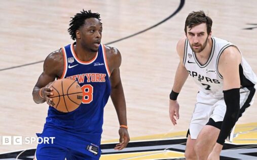 OG Anunoby celebrating on court in a New York Knicks jersey during the NBA Finals