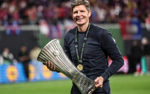 Oliver Glasner waving to Crystal Palace fans from the touchline