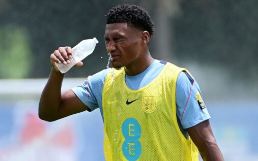 Ollie Watkins celebrating on the pitch in an Aston Villa shirt