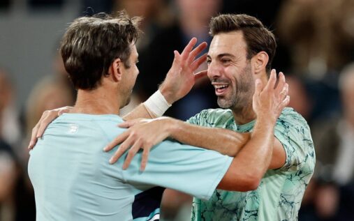 Henry Patten and Harri Heliovaara walking off the clay court after losing the French Open men's doubles final in Paris