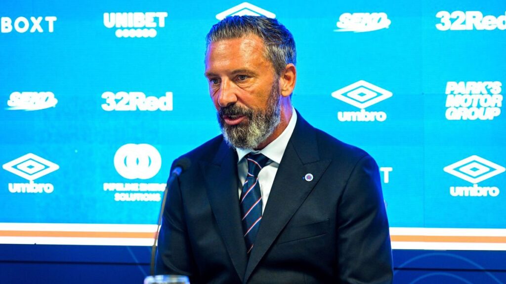 Derek McInnes smiling at a press conference after being unveiled as the new Rangers manager