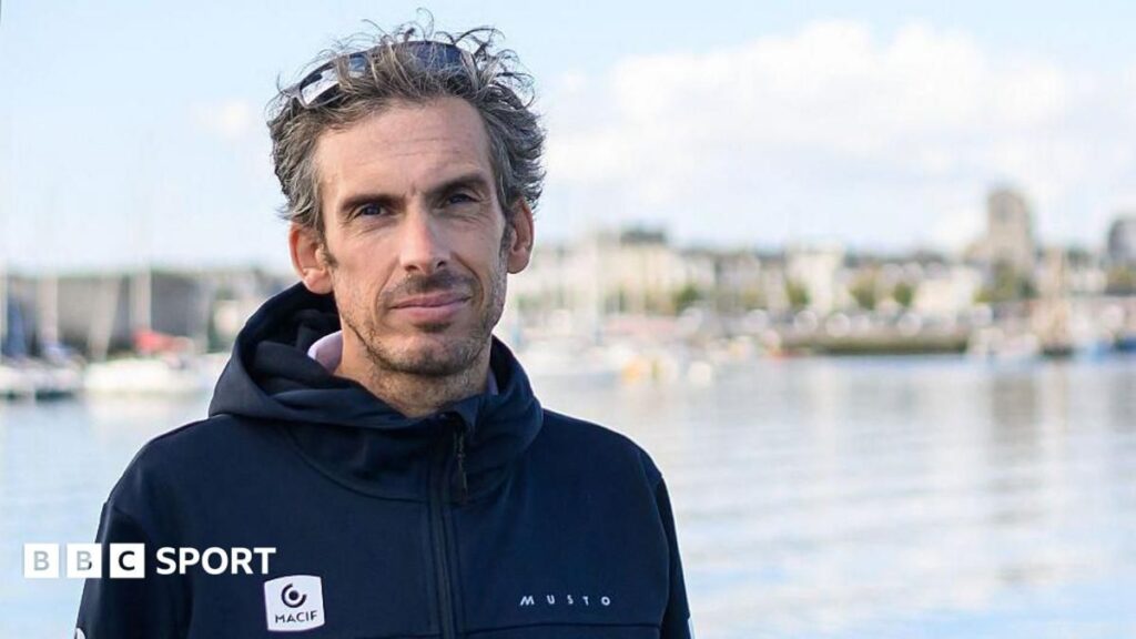 French sailor Charlie Dalin smiling aboard his racing yacht during the Vendee Globe